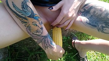 Shameless Lucy Ravenblood pleasure her cunt with corn outdoor in the sunshine